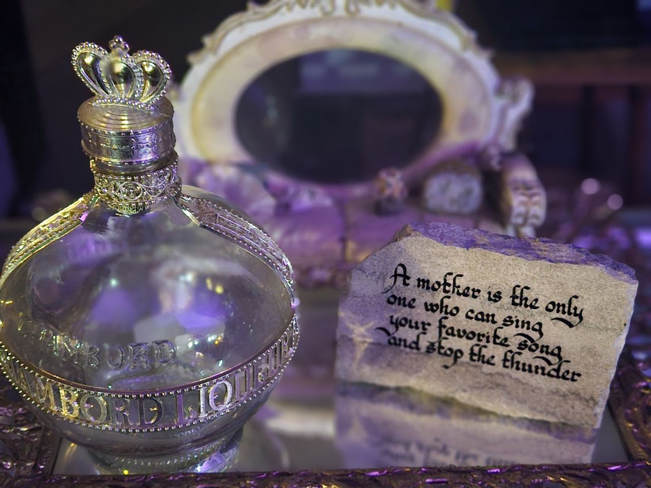 Vintage bottle and decorative rock with saying
