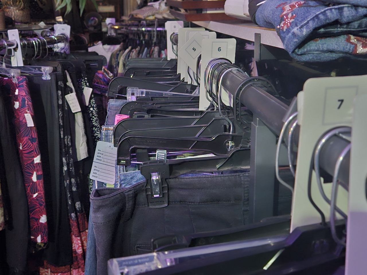 Pants on a rack in a thrift store