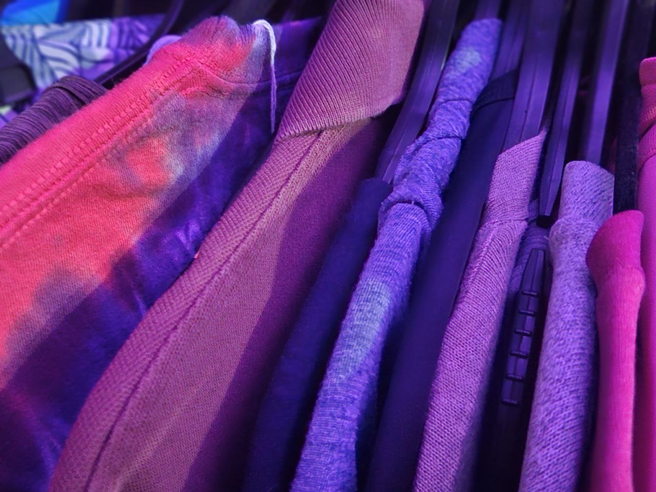 Shirts on a rack in a thrift store
